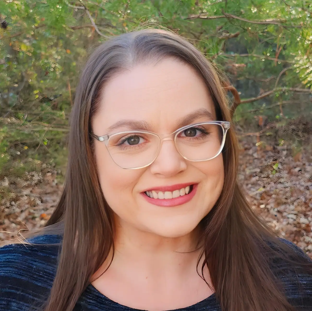 A professional headshot of Brenna S. Ort, a friendly and experienced bookkeeper, showcasing her approachable and trustworthy demeanor